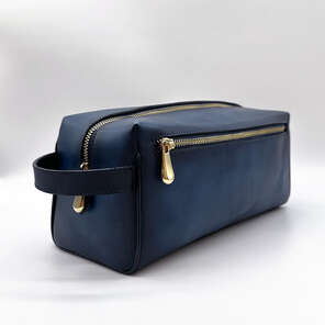 Karun Leather navy blue diamond travel kit with gold-colored accessories